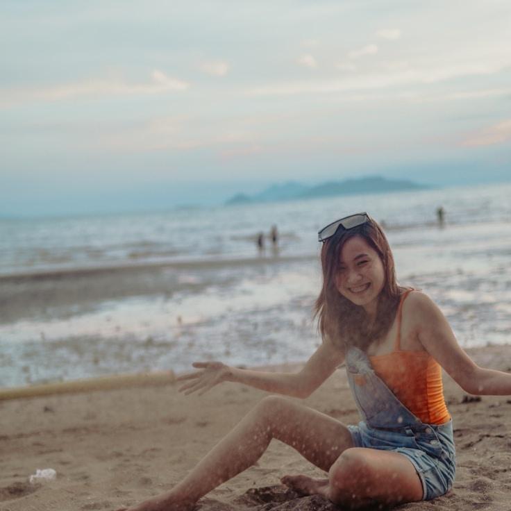 Kaveri Mehta, Lead Design Curator at AutumnIslandSouth, reviewing corporate floral arrangements